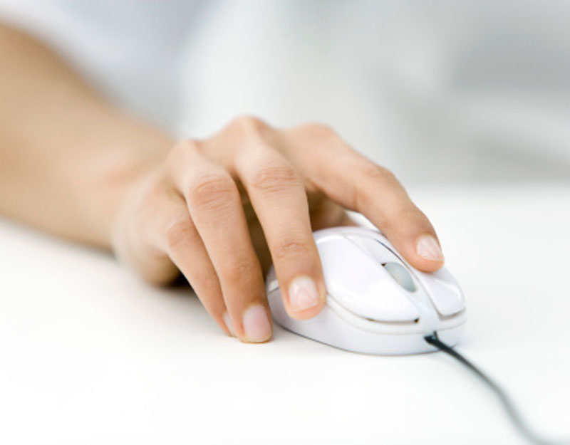 Hand on Computer Mouse