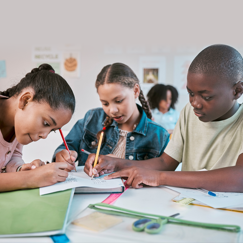 Children collaborating around a table.